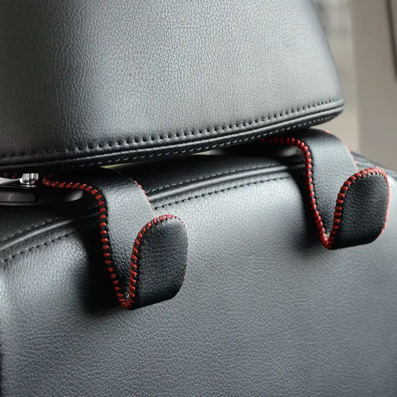 Thumbnail: Black leather car seat headrest hooks with red stitching