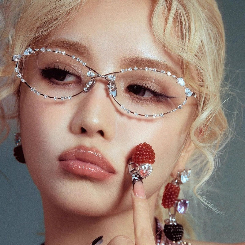 Woman with blonde hair wearing bedazzled silver glasses