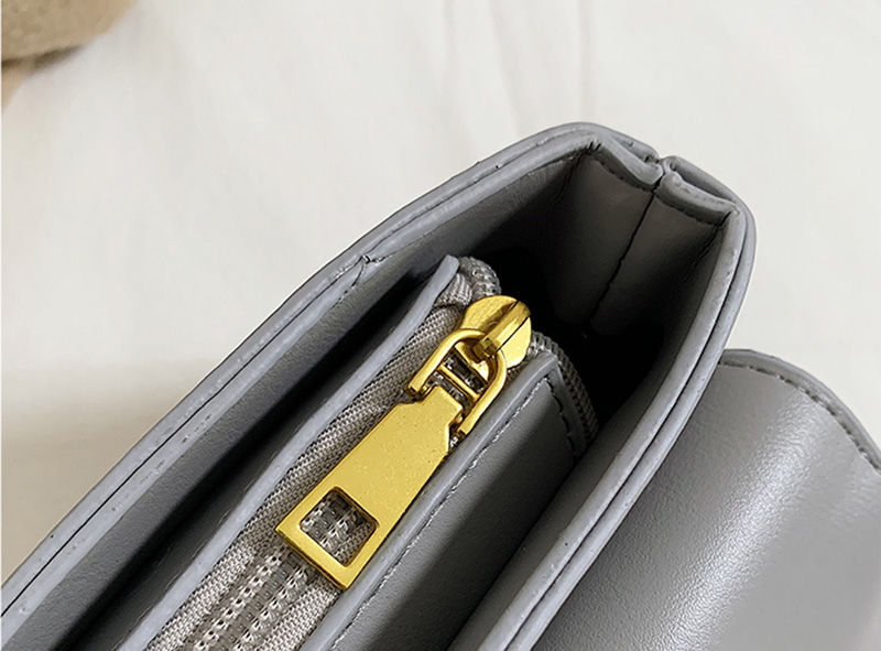 Thumbnail: Gold zipper detail on a grey PU leather designer handbag