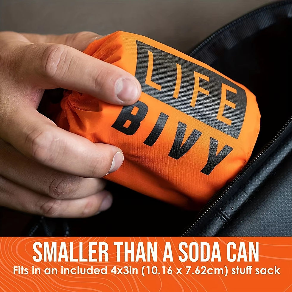 Thumbnail: Small orange Life Bivy stuff sack held in a hand.