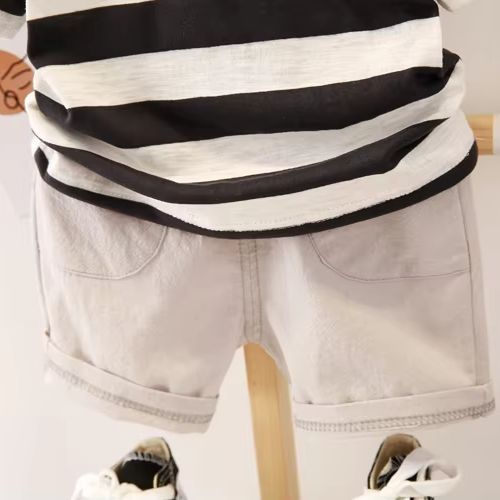 Thumbnail: Sleeveless black and white striped top with white shorts