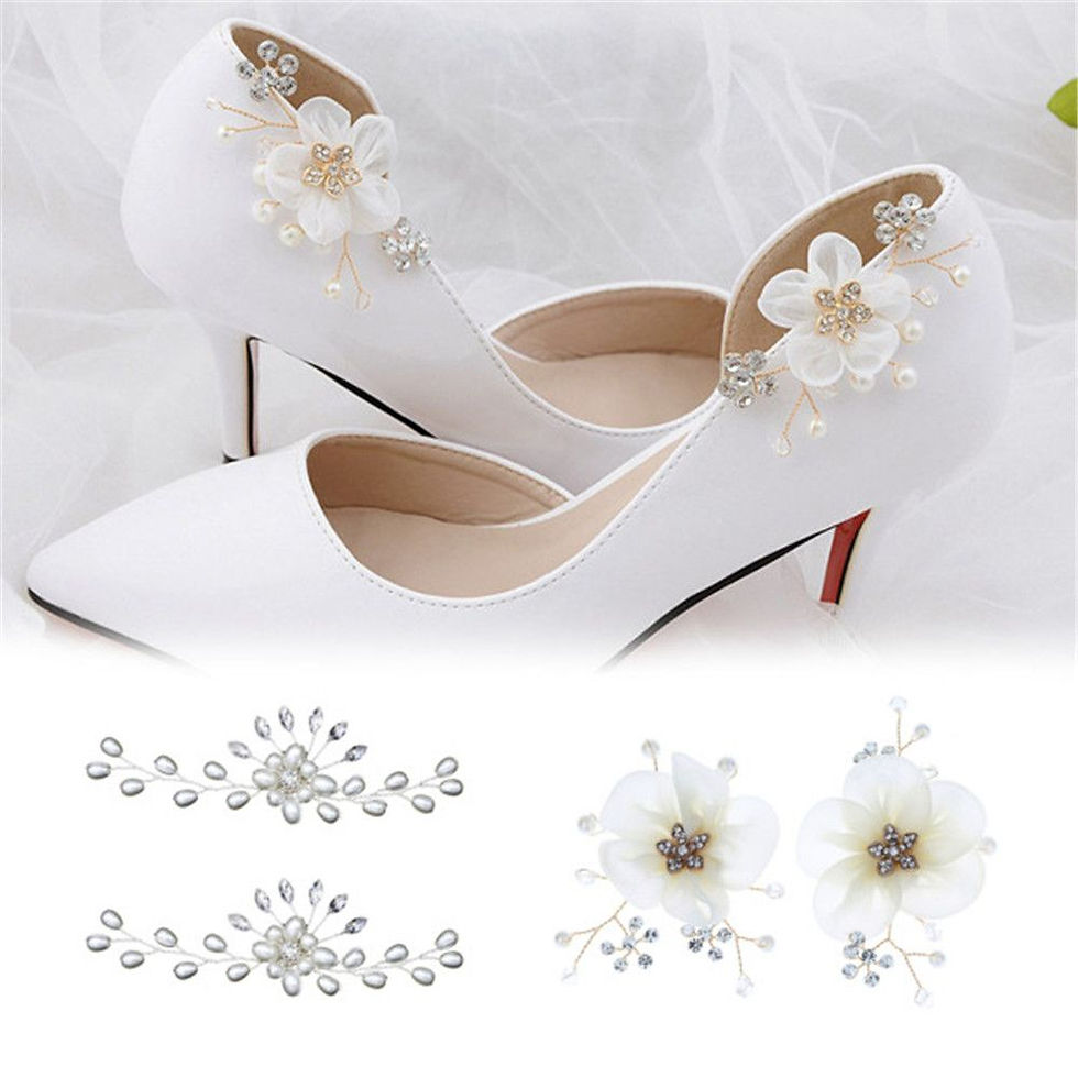 White wedding shoes decorated with flower rhinestone clips.