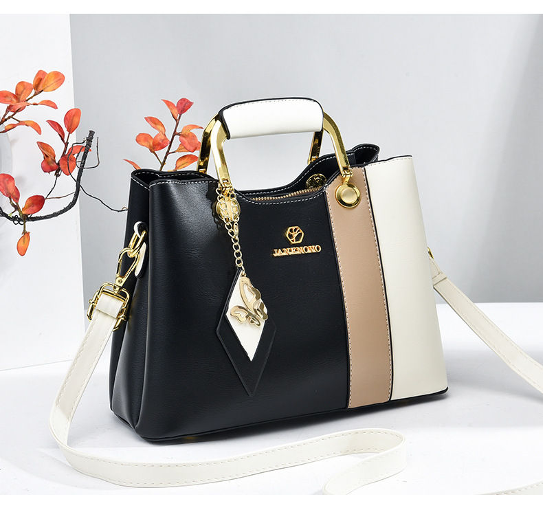 Thumbnail: Black and white ladies top handle satchel with cat charm