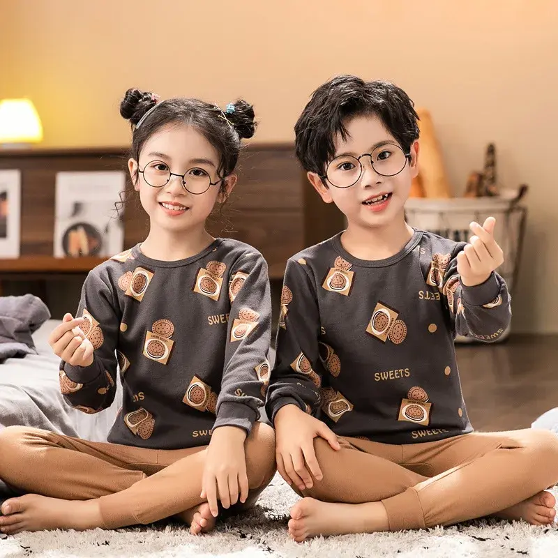 Thumbnail: Two kids wearing glasses and Cotton Kids Pyjamas, smiling at camera.