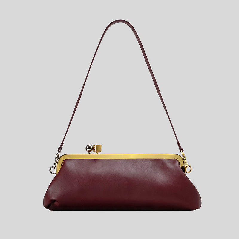 Thumbnail: Luxury burgundy kiss lock clutch bag with shoulder strap
