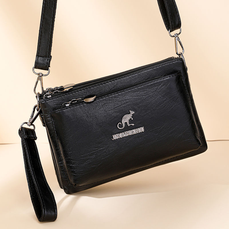 Thumbnail: Black multi-layer crossbody messenger bag with kangaroo logo