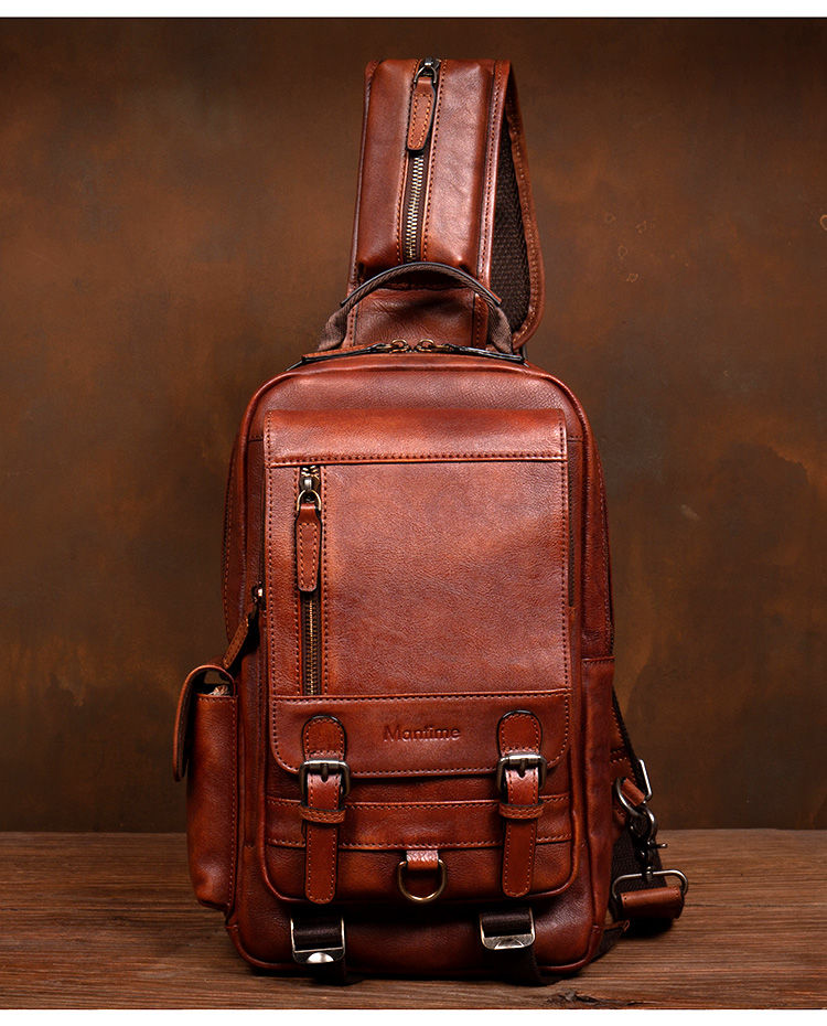 Thumbnail: Men's handmade leather chest bag with buckle straps.