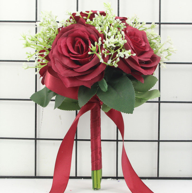 Thumbnail: Red silk rose and babysbreath wedding bouquet.