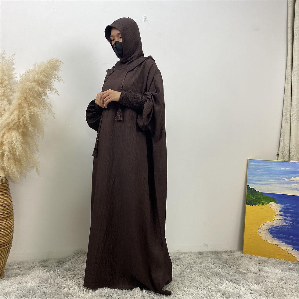 Thumbnail: Woman wearing a dark brown hooded abaya with a niqab.
