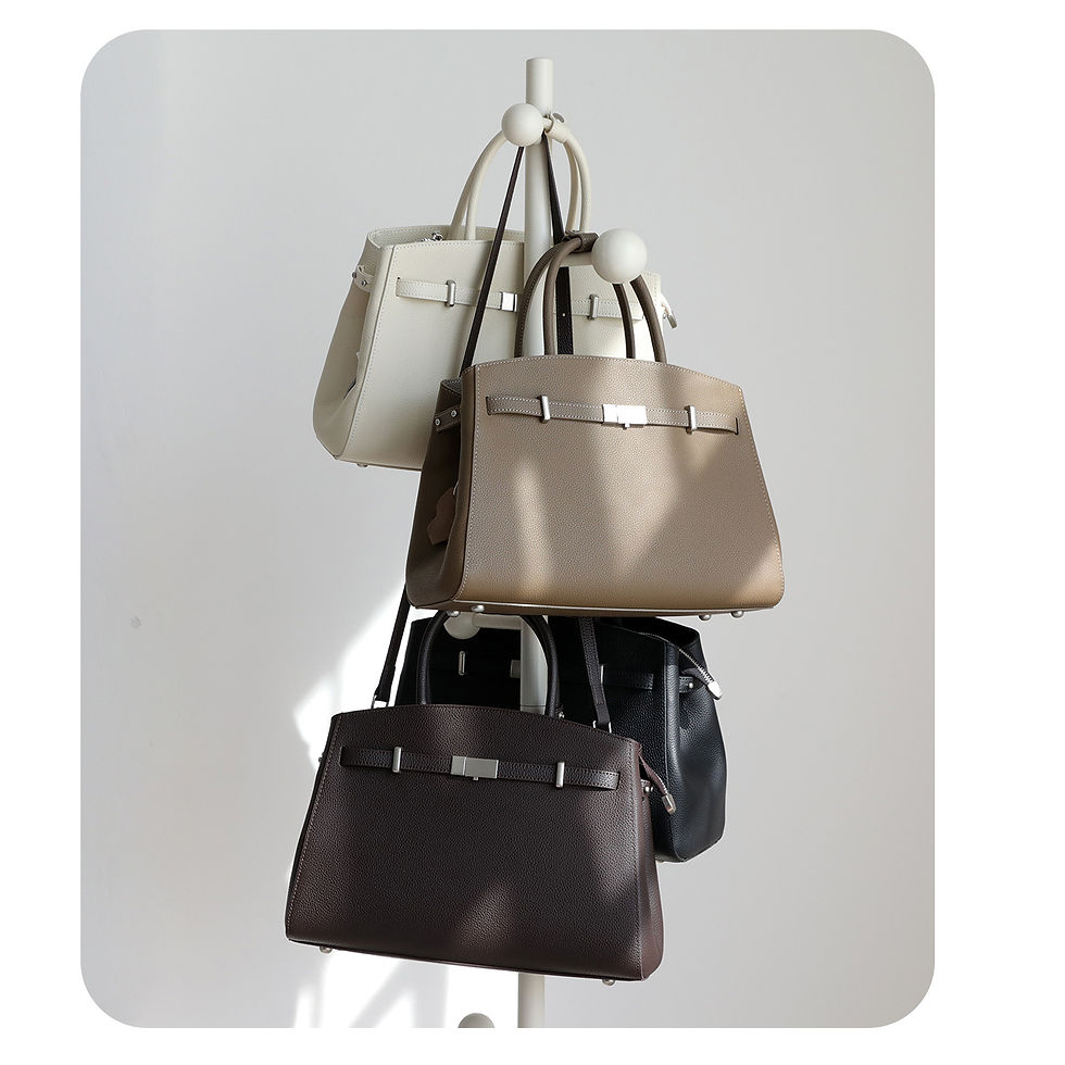 Thumbnail: Leather tote briefcases hanging on a stand