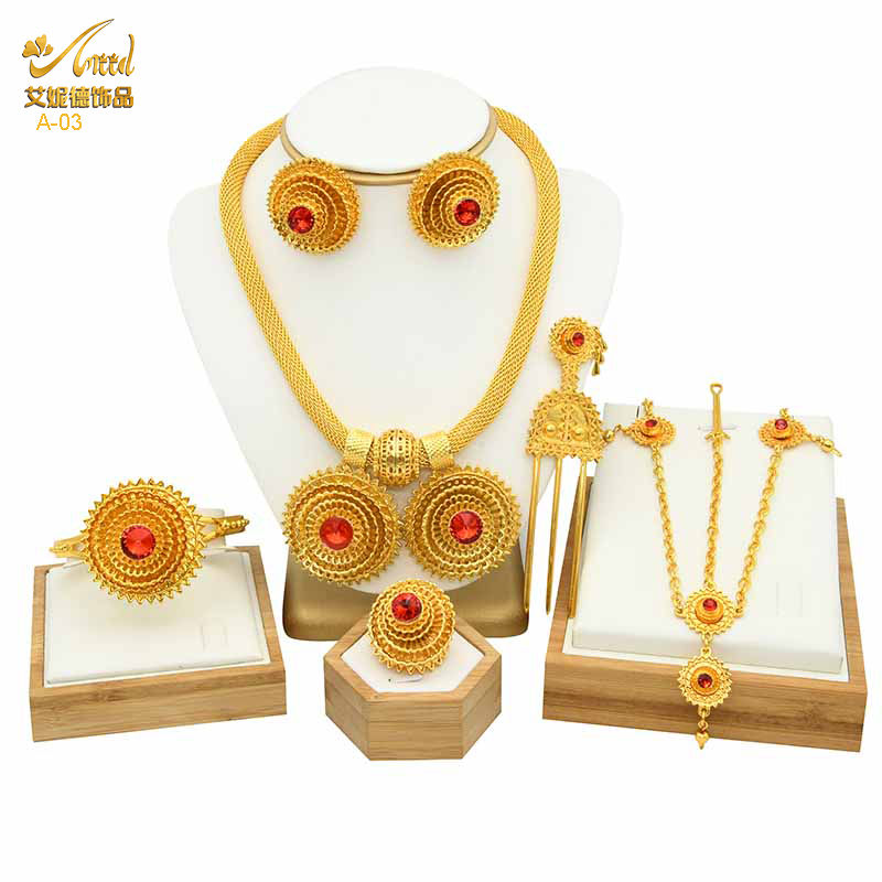 Thumbnail: ANIID Ethiopian gold jewelry set with flower shapes and red stones