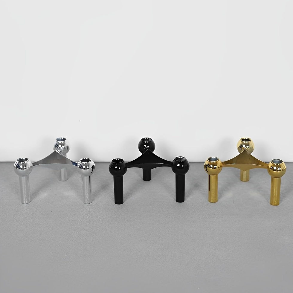 Thumbnail: Three modular metal candle holders in silver, black, and gold