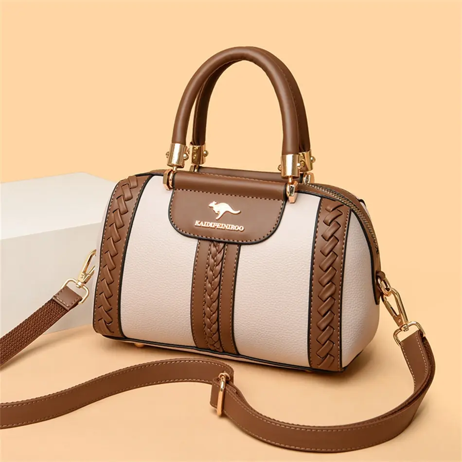 Thumbnail: Luxury leather handbag with braided trim and shoulder strap