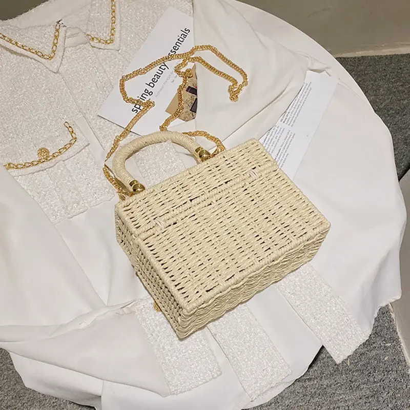 Thumbnail: Small rattan straw woven crossbody handbag on white shirt