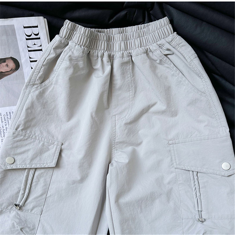 Thumbnail: Grey high-waisted cargo pants with elastic waistband