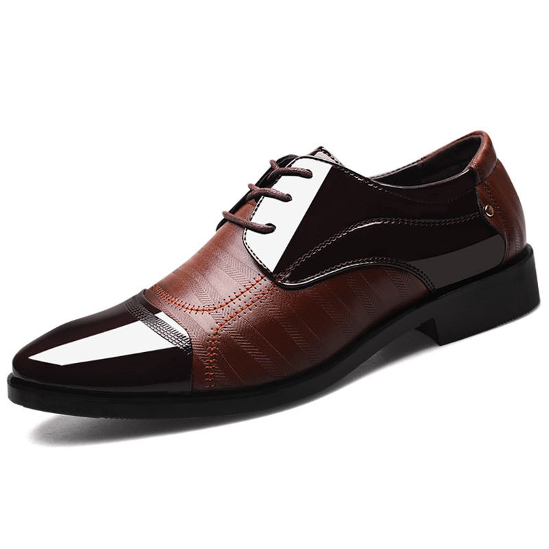 Thumbnail: Brown and black leather men's dress shoes with laces.