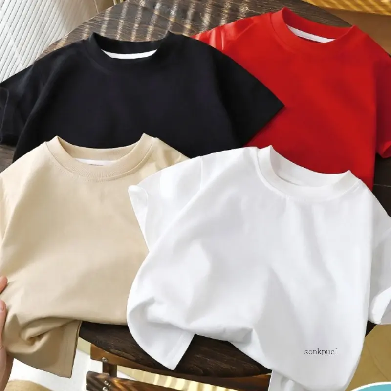 Four folded solid color sportswear t-shirts in black, red, beige, and white.