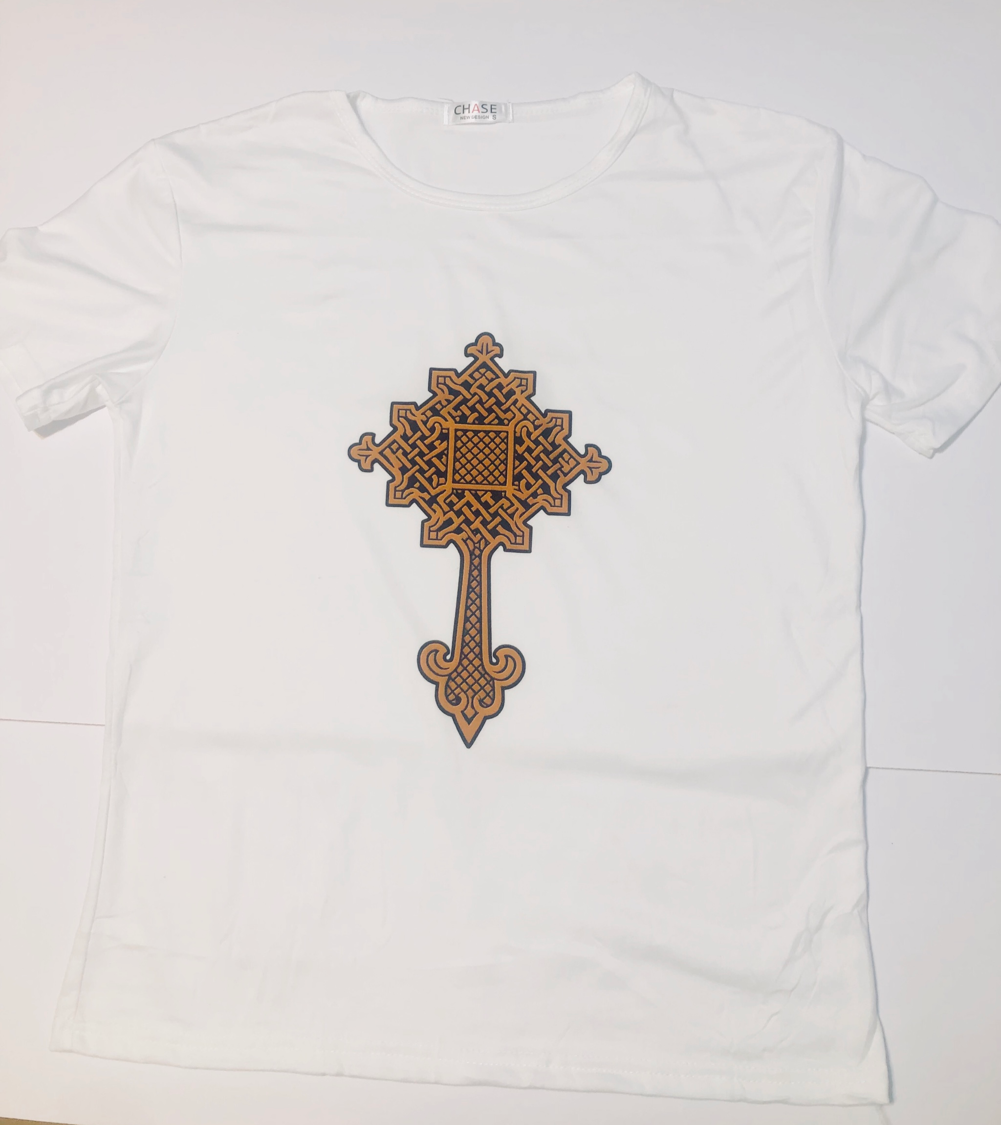 White t-shirt with a brown cross design on a white background.
