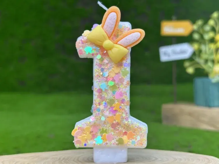 Thumbnail: Glittery number 1 birthday candle with yellow bunny ears