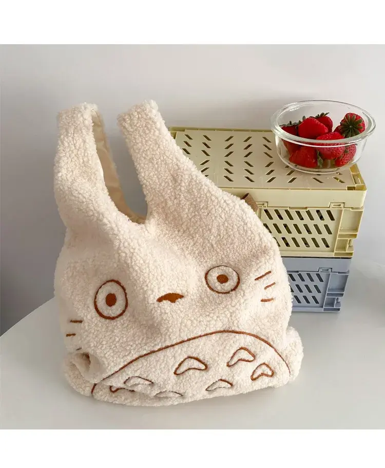 Thumbnail: White plush Totoro handbag on a white table