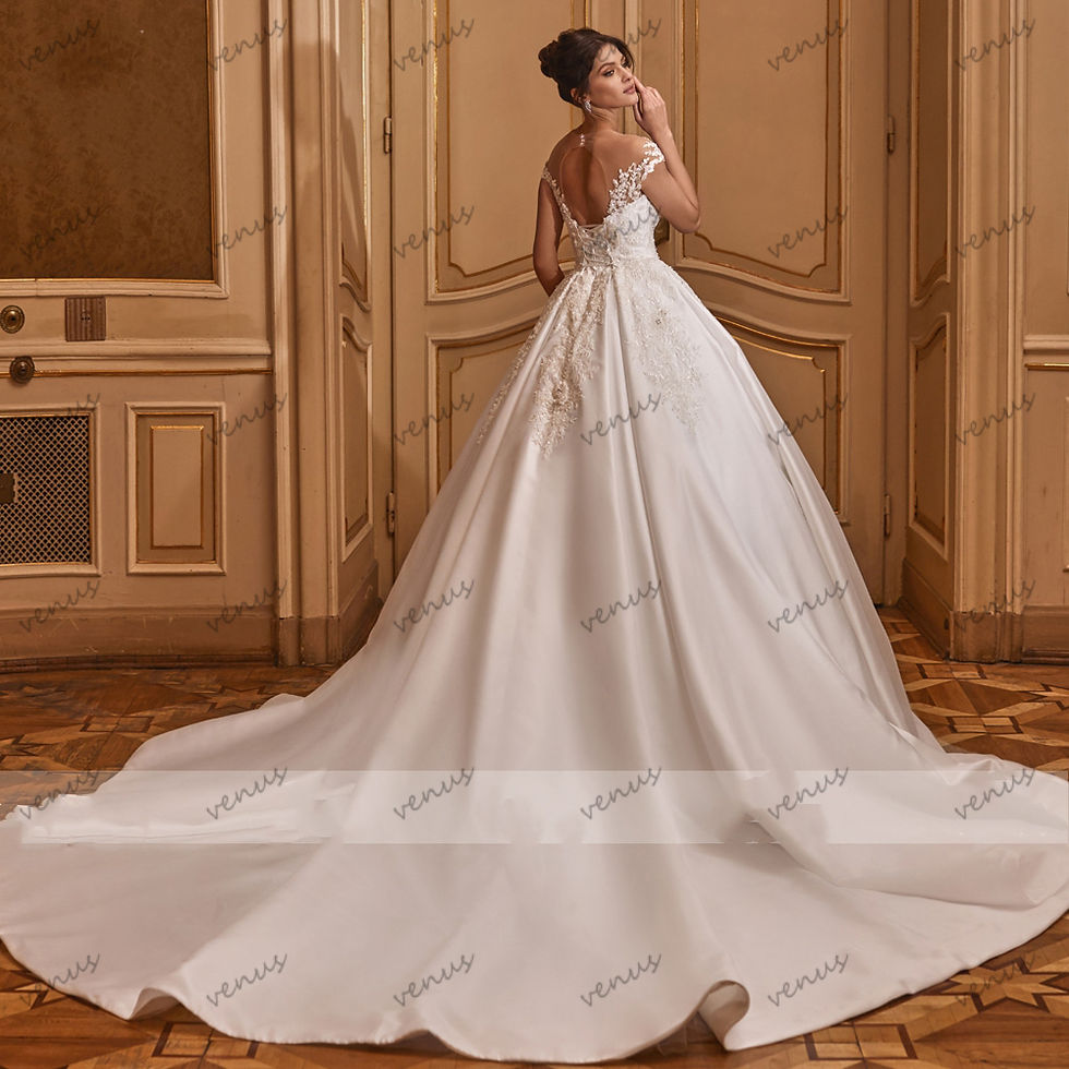 Satin floor-length bridal gown with lace appliques and train