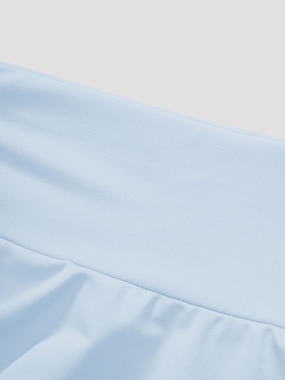 Thumbnail: High waist detail of a light blue solid color skirt.