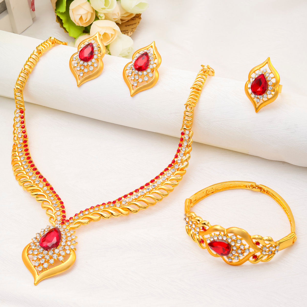 Luxury Dubai 24k gold jewelry set with red zircon stones.
