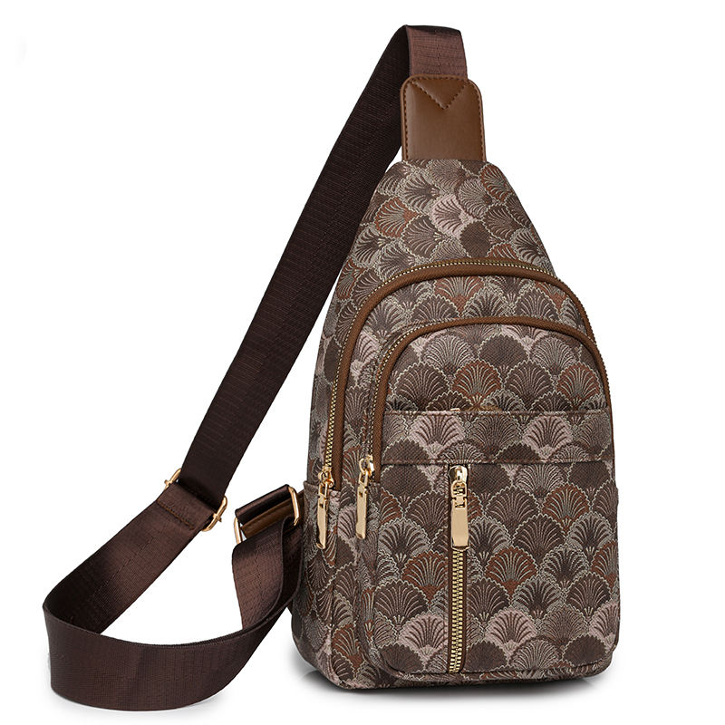 Thumbnail: Brown patterned women's chest purse with crossbody strap.