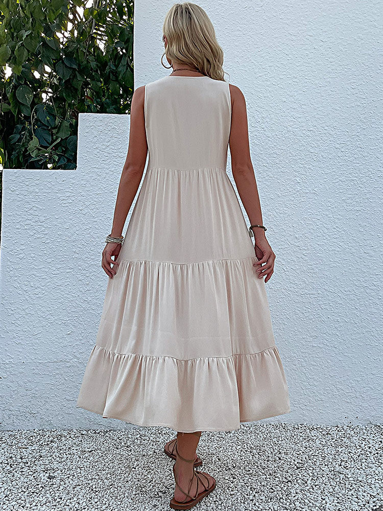 Thumbnail: Woman from behind wearing a beige tiered sleeveless dress