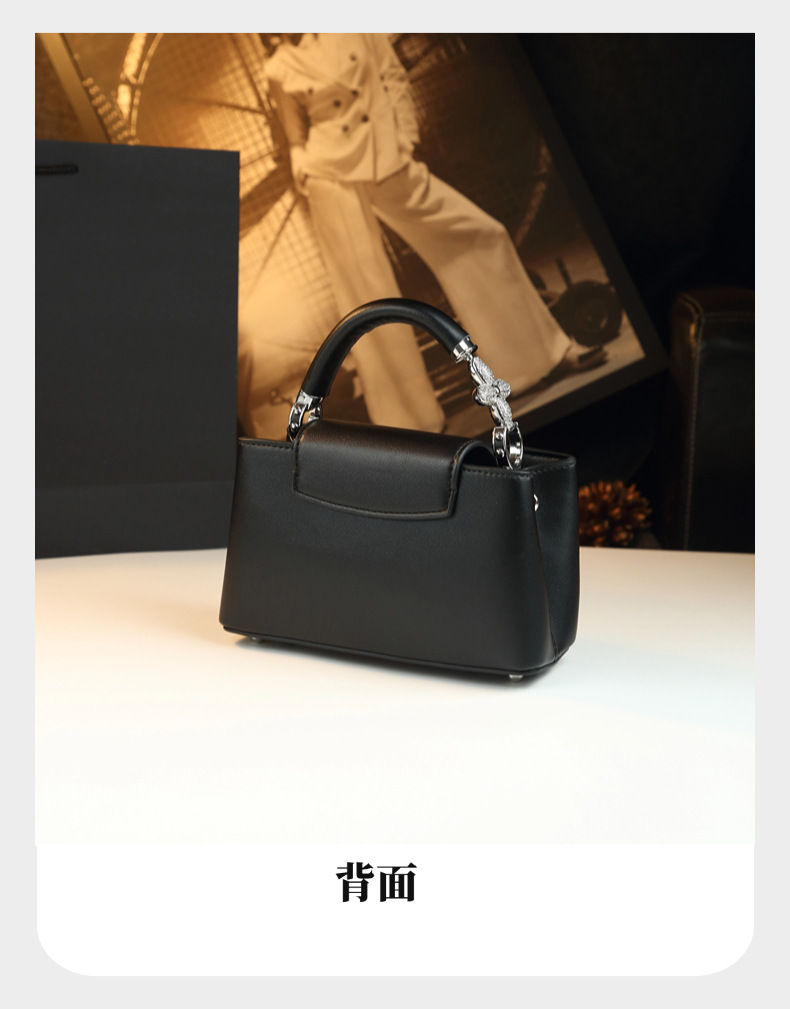Thumbnail: Small black luxury leather designer party bag with top handle