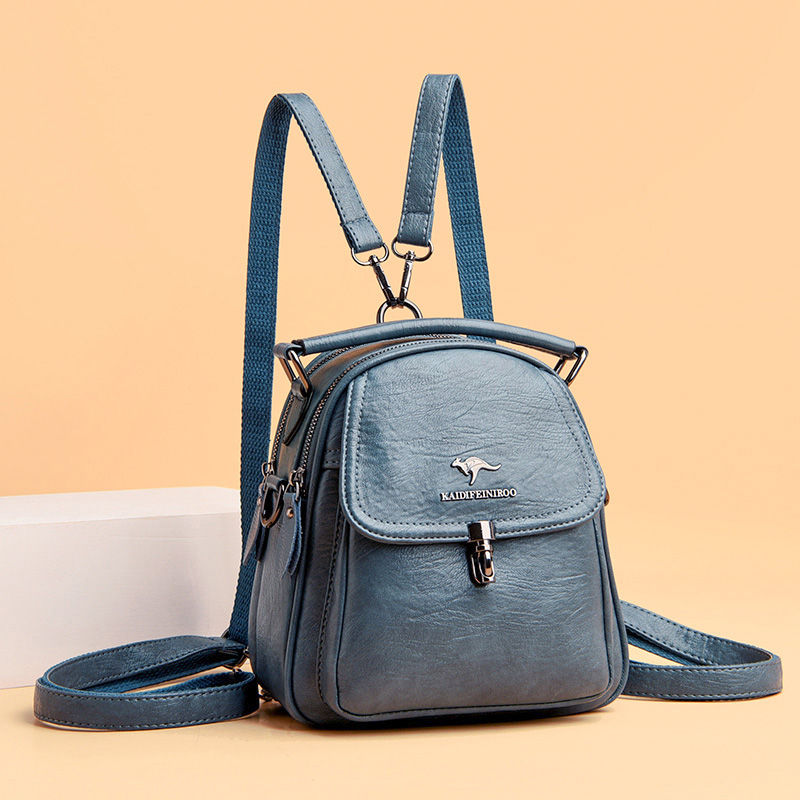 Thumbnail: Small blue leather fashion backpack with multiple straps.