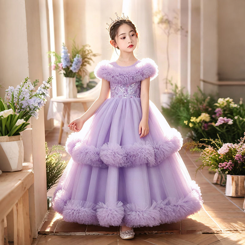 Girl in a puffy lavender tulle wedding dress with ruffles