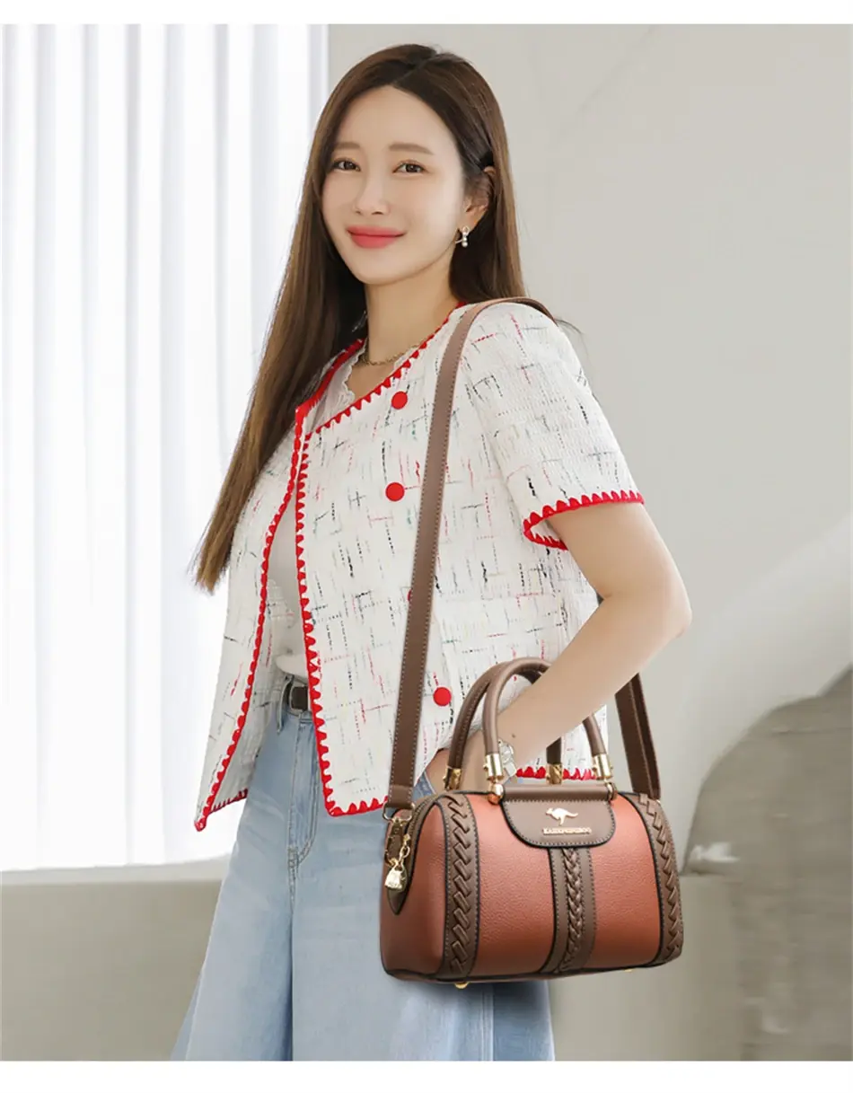 Thumbnail: Woman carrying luxury designer leather handbag and shoulder bag