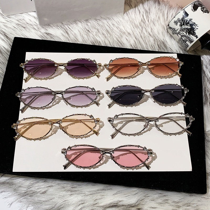 Thumbnail: Collection of oval sunglasses with various tinted lenses