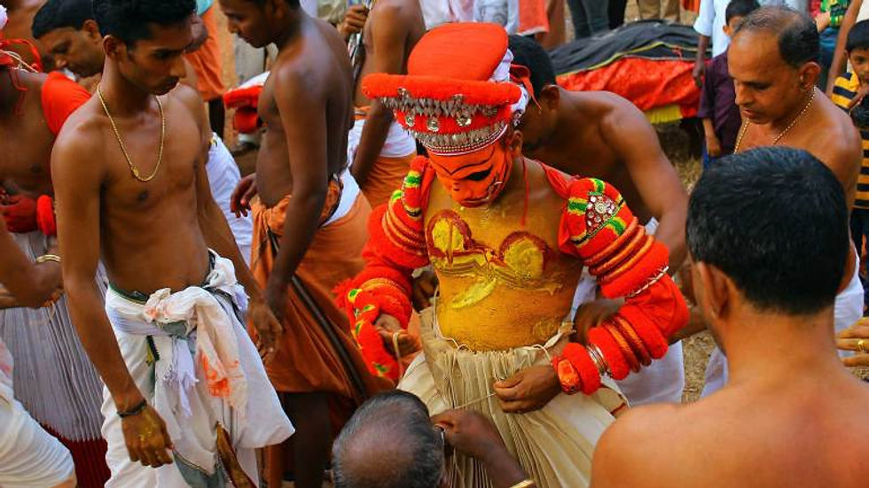 Wearing-the-costumes-(Theyyam-kettal)