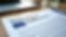 Eye-level view of a printed EU Declaration of Conformity document on a wooden desk