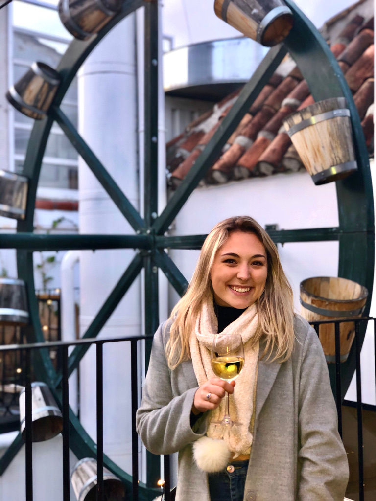 Alex enjoying a glass of wine on the rooftop at the Hat Hostel Madrid