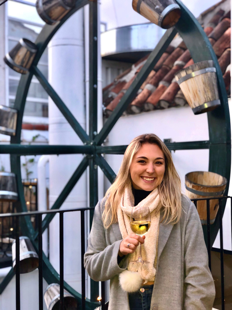 Alex enjoying a glass of wine on the rooftop at the Hat Hostel Madrid