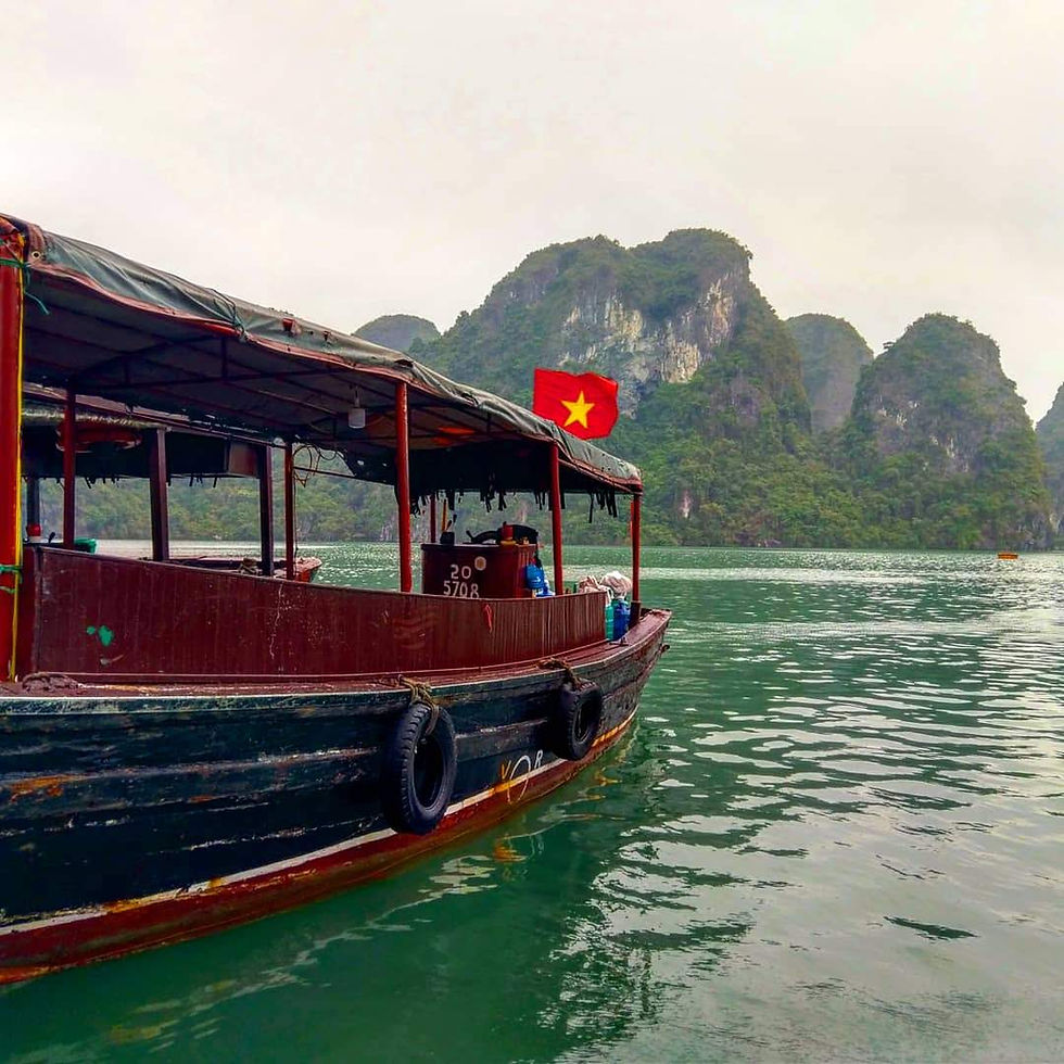 A small tender boat used to shuttle cruises from their ships to smaller points of interest in Ha Long Bay, Vietnam