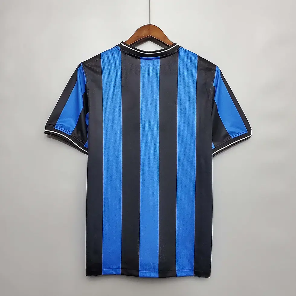 Thumbnail: Back of a blue and black striped retro football shirt
