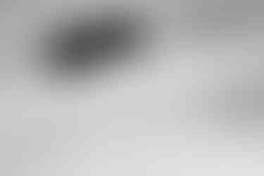 Black and white photo of snowboard powder turns in the Whistler backcountry, BC.