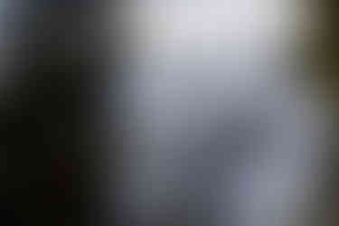 Backcountry skiiers on top of a mountain in Cayoosh Pass