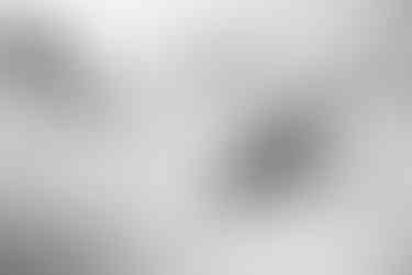 Black and white photo of people traveling up Cayoosh Mountain on a cloudy day.