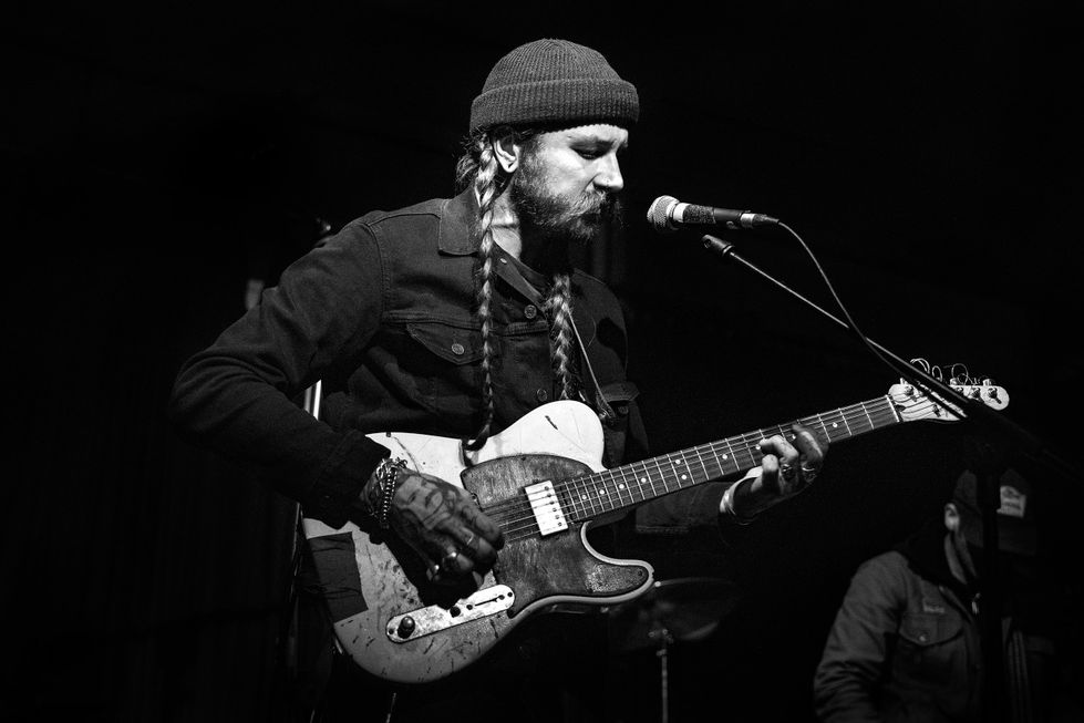 Black & White photo of Kadabra guitarist live