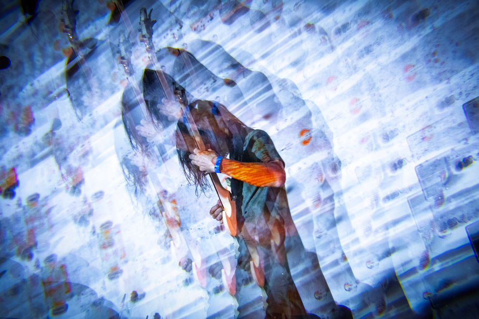 Colorful photo of SLIFT guitarist live
