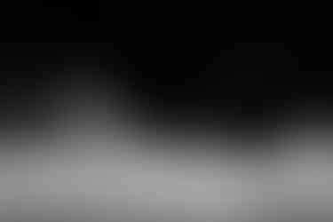 Black and white photo of a paddleboarder on a misty Emerald Lake, BC.