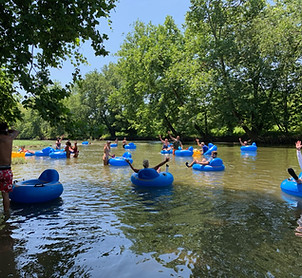 Group of people tubing in a river