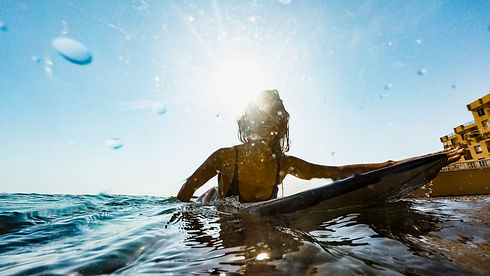 woman-with-surfboard-water.jpg