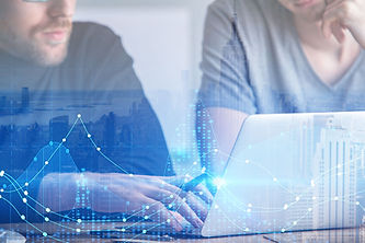 Employees Preforming Due Diligence on Laptop with Blue Lights