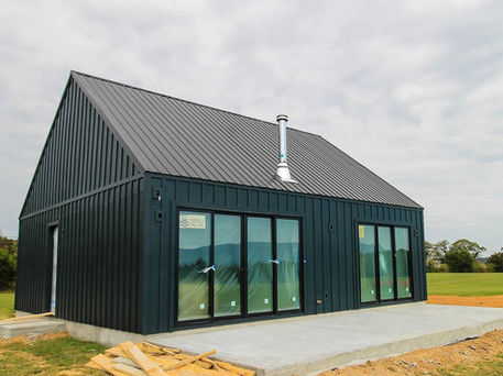 Converted garage with insulated walls, painted drywall, and new flooring